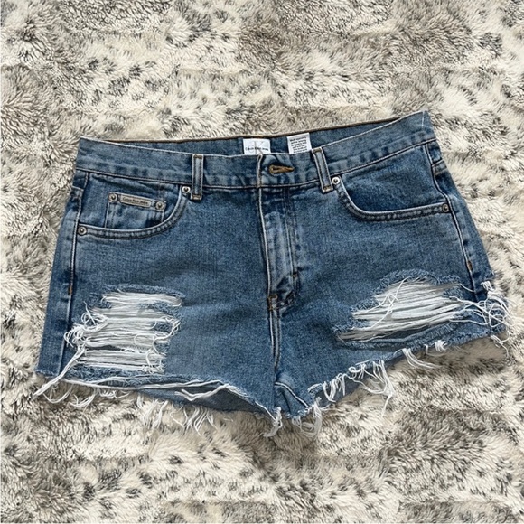 Calvin Klein Pants - Vintage handcrafted Calvin Klein distressed jean shorts